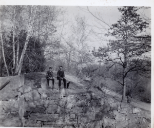 Harold Eames and Robert Carter sitting on abuttment of aquaduct of the Middlesex Canal on Shawsheen Ave at the Billerica Line. Circa 1905.